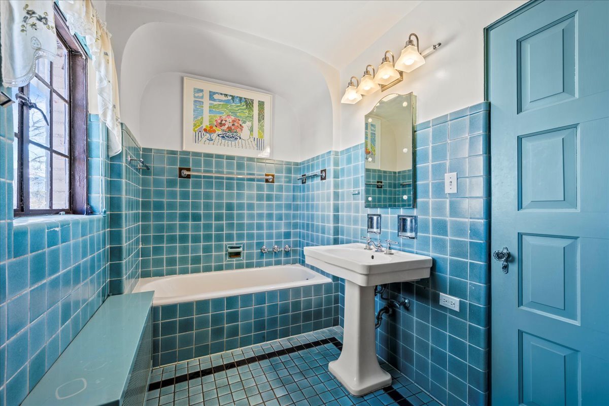 260 Oxford Road Kenilworth, IL 60043 - Photo 50 of 61 a bathroom with a sink a mirror and a shower