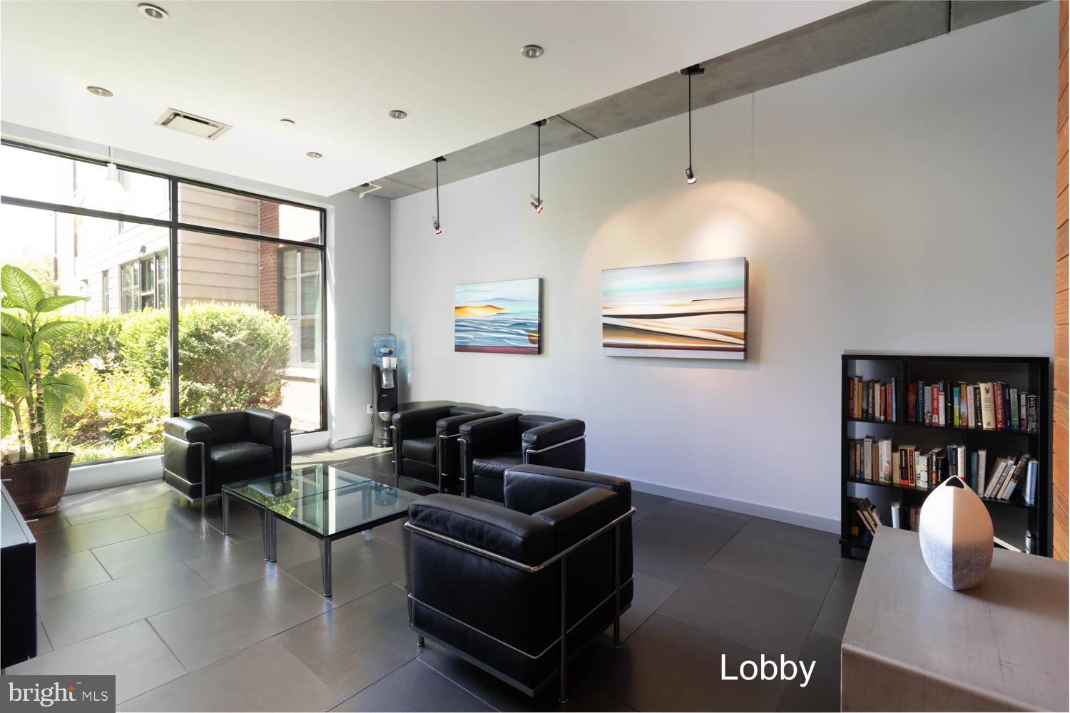 317-319 Vine Street, Unit 308 Philadelphia, PA 19106 - Photo 14 of 17 a living room with furniture and large window