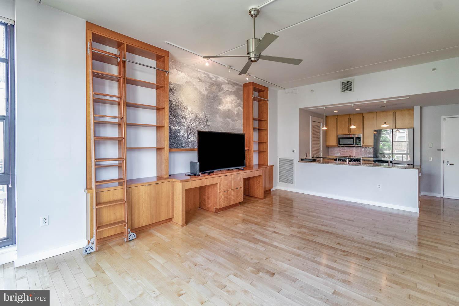 317-319 Vine Street, Unit 308 Philadelphia, PA 19106 - Photo 4 of 17 a view of a living room kitchen and a wooden floor
