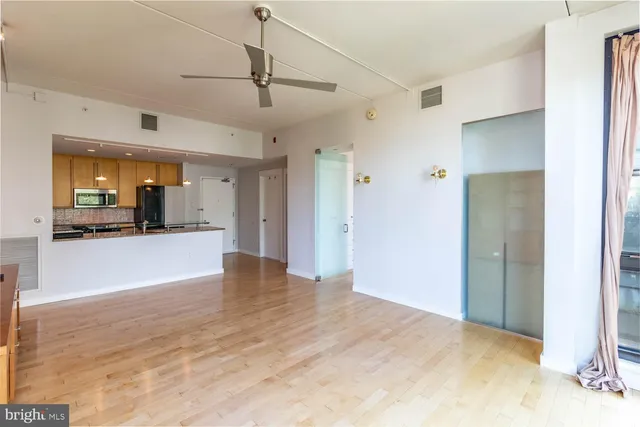 a view of a livingroom with a kitchen