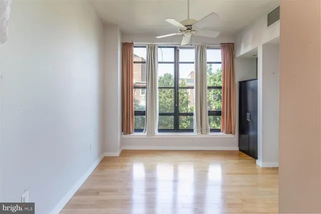 a view of an empty room with a window