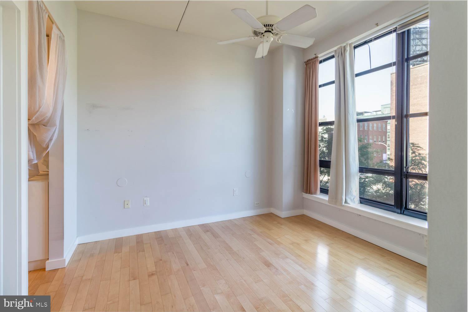 317-319 Vine Street, Unit 308 Philadelphia, PA 19106 - Photo 10 of 17 an empty room with a empty space and windows