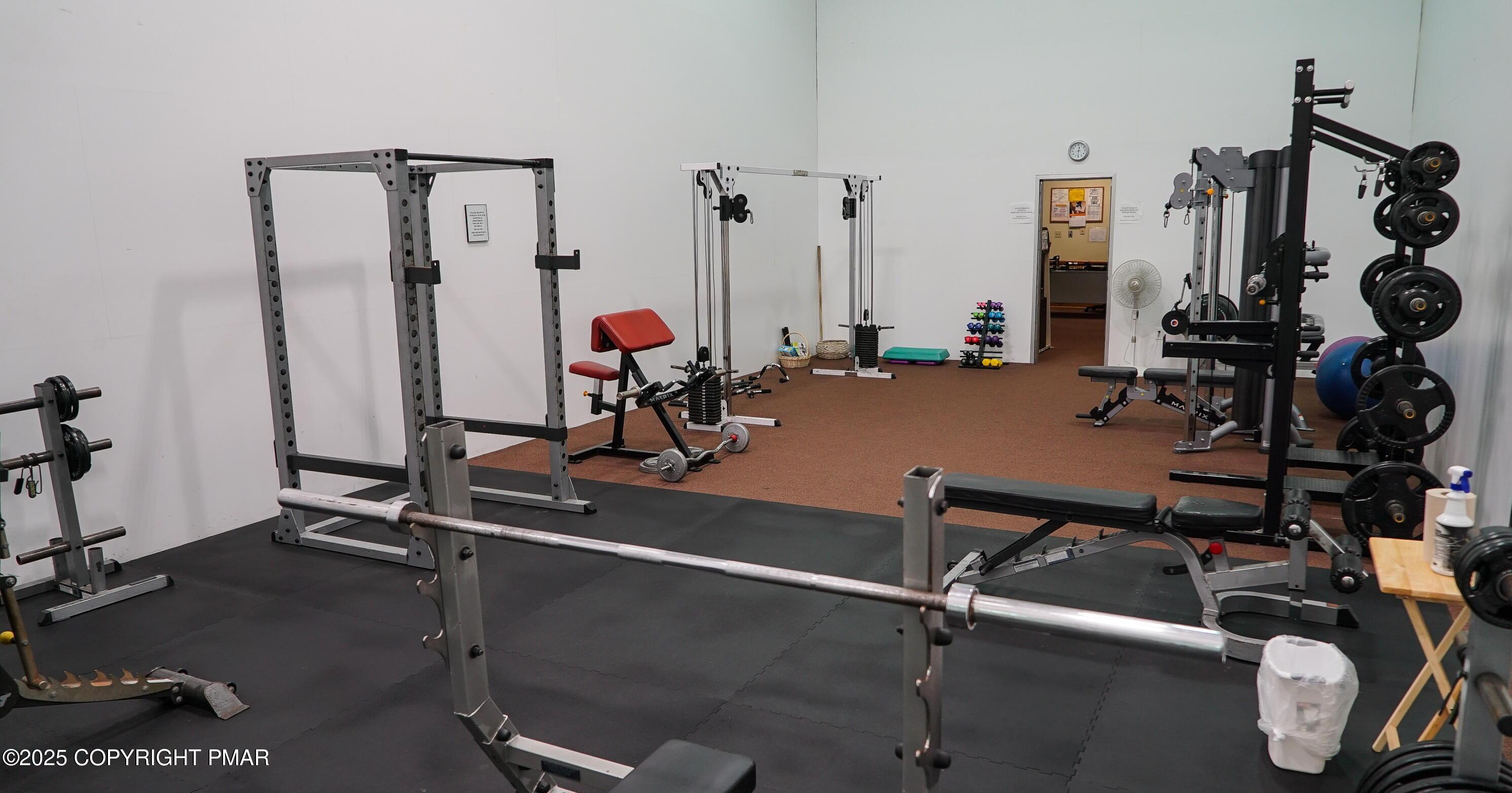 Lot 695 Decker Road Bushkill, PA 18324 - Photo 11 of 55 a room with gym equipment and windows