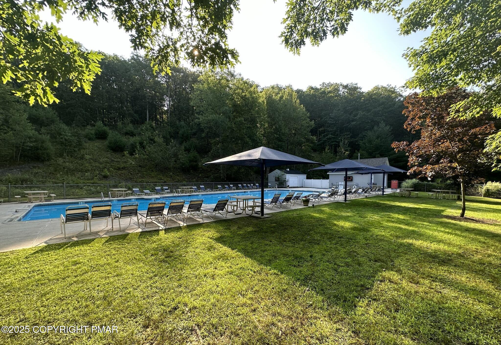 Lot 695 Decker Road Bushkill, PA 18324 - Photo 29 of 55 a view of a swimming pool with a table and chairs