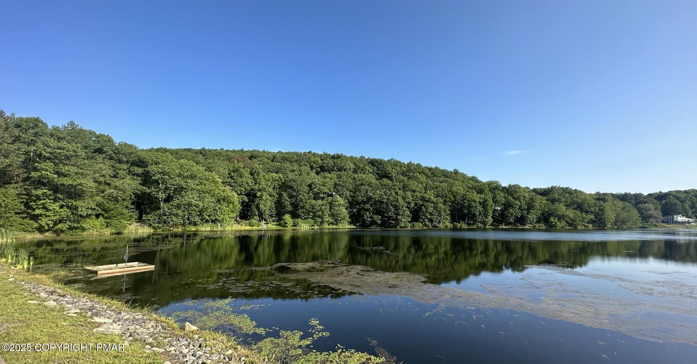Lot 695 Decker Road Bushkill, PA 18324 - Photo 35 of 55 a view of a lake with a mountain in the background
