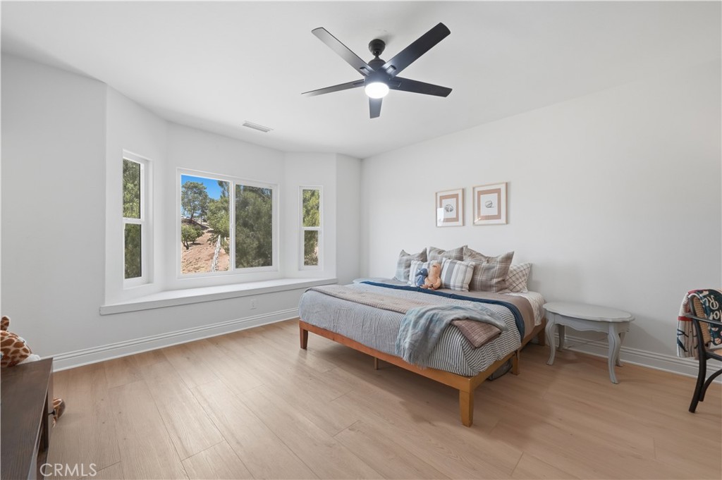 41110 Los Ranchos Circle Temecula, CA 92592 - Photo 42 of 77 a bed room with a bed and a window