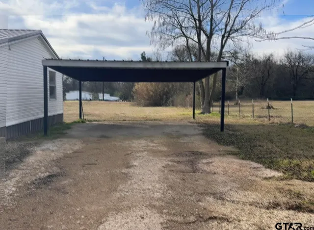 a view of a yard with a slide