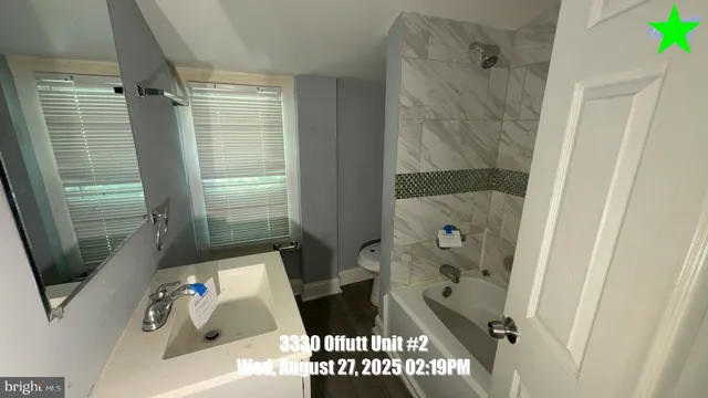 a bathroom with a tub and shower