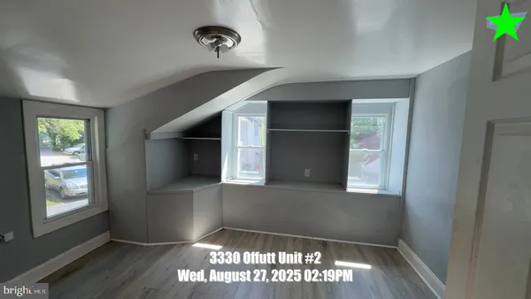 a kitchen with granite countertop white cabinets and appliances