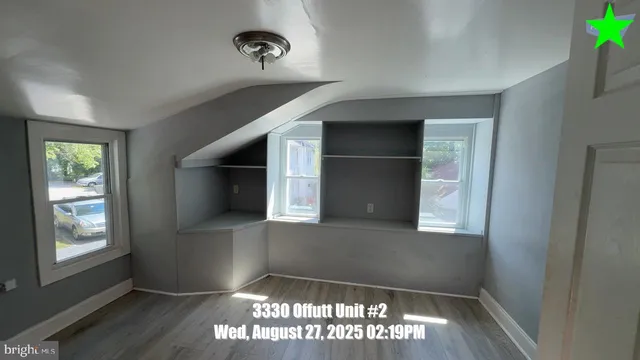 a kitchen with granite countertop white cabinets and appliances