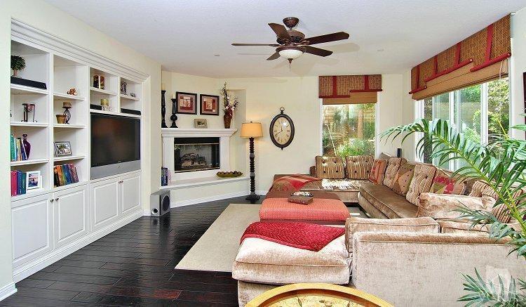 1373 Hidden Ranch Drive Simi Valley, CA 93063 - Photo 14 of 50 a living room with furniture a flat screen tv and a fireplace