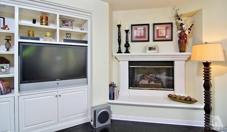 1373 Hidden Ranch Drive Simi Valley, CA 93063 - Photo 15 of 50 a living room with painting on the wall and a flat screen tv