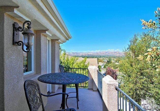 1373 Hidden Ranch Drive Simi Valley, CA 93063 - Photo 30 of 50 a view of balcony with a table and chairs