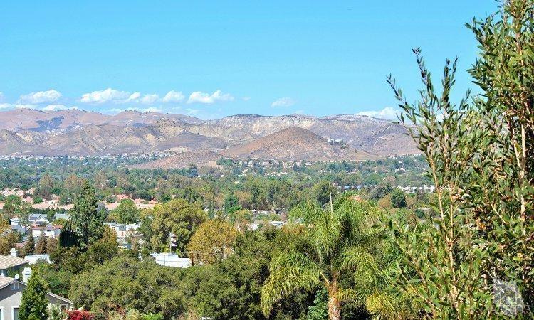 1373 Hidden Ranch Drive Simi Valley, CA 93063 - Photo 31 of 50 a view of a city with lush green forest