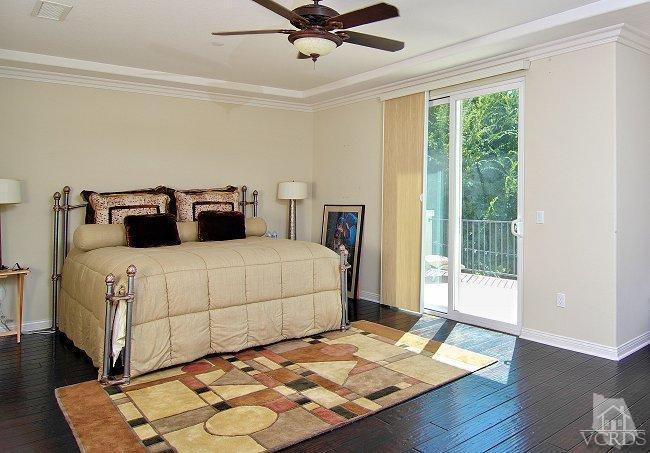 1373 Hidden Ranch Drive Simi Valley, CA 93063 - Photo 35 of 50 a bedroom with a bed and wooden floor