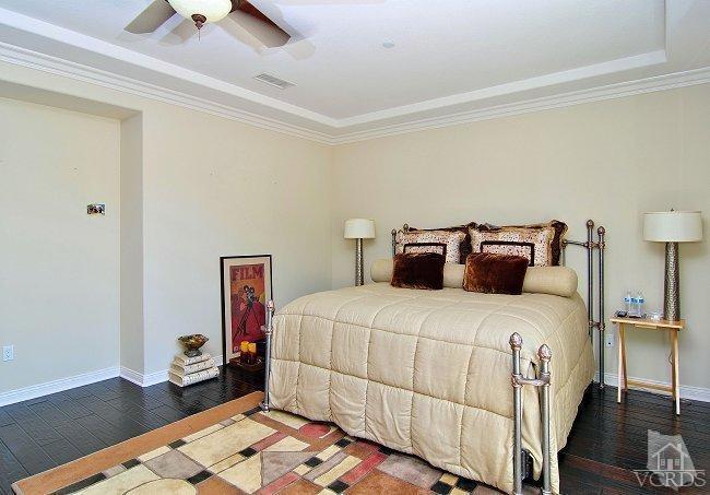 1373 Hidden Ranch Drive Simi Valley, CA 93063 - Photo 36 of 50 a bedroom with a bed and wooden floor