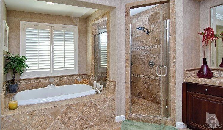 1373 Hidden Ranch Drive Simi Valley, CA 93063 - Photo 39 of 50 a bathroom with a granite countertop tub a sink and a shower