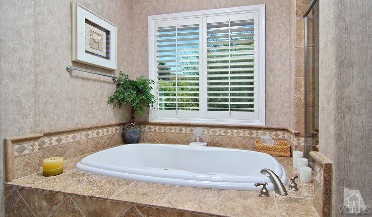 1373 Hidden Ranch Drive Simi Valley, CA 93063 - Photo 41 of 50 a bathroom with bathtub and window