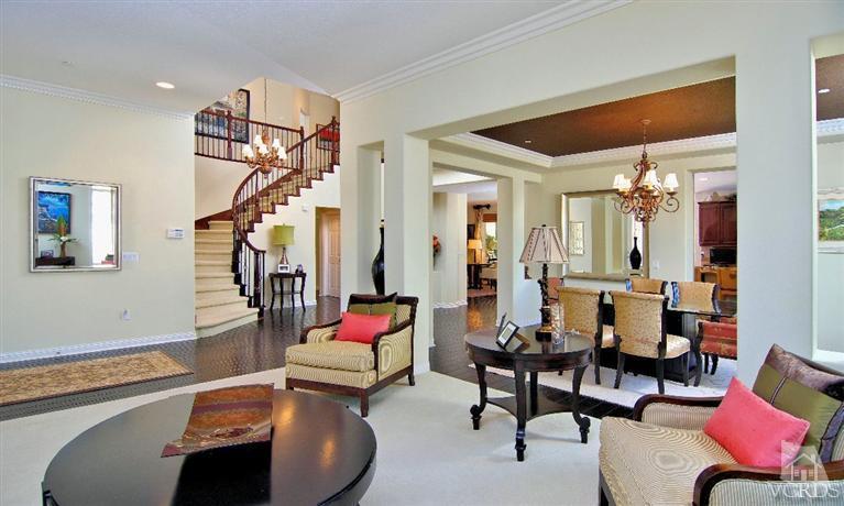 1373 Hidden Ranch Drive Simi Valley, CA 93063 - Photo 9 of 50 a living room with furniture a rug and a chandelier