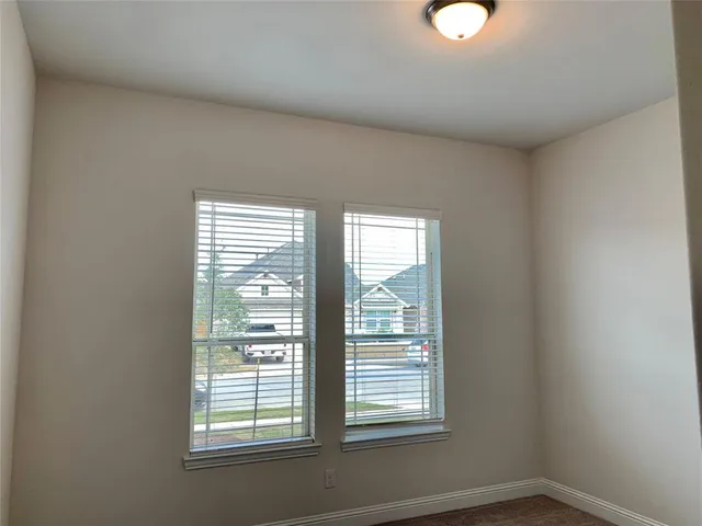 a bathroom with a shower and a shower