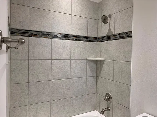 a bathroom with a mirror and a sink