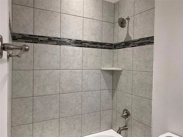a bathroom with a mirror and a sink