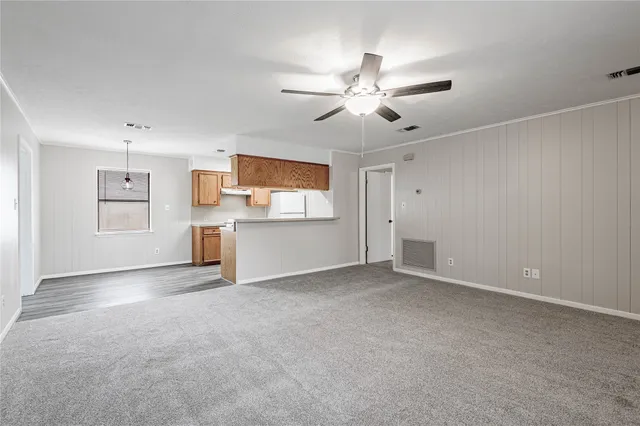 a room with a wooden floor and window
