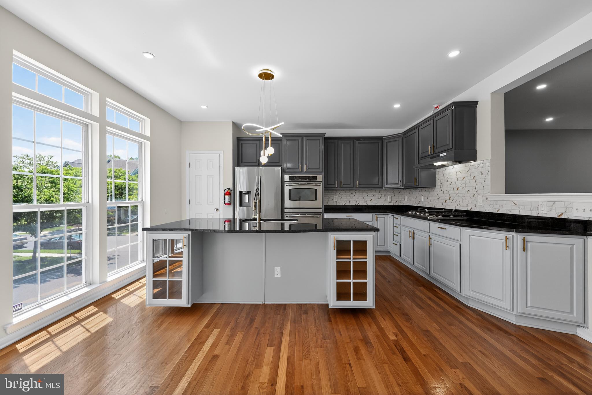 3 Swan Court Delran, NJ 08075 - Photo 14 of 34 a kitchen with stainless steel appliances granite countertop a stove a sink and a refrigerator