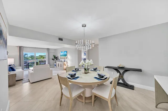 a view of a dining room with furniture and window