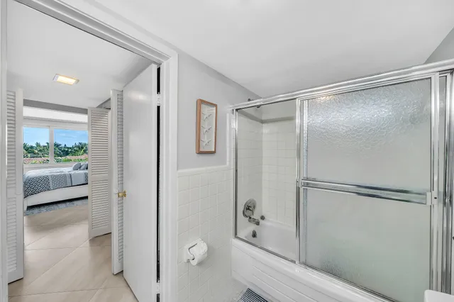 a bathroom with a shower and a toilet