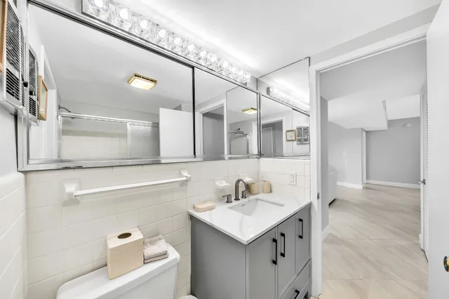 a dining room with furniture and chandelier