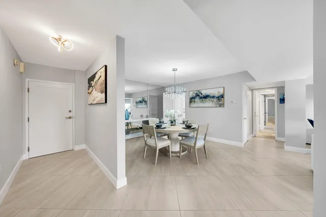 a kitchen with a stove and white cabinets