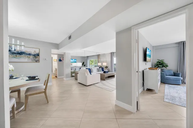 a bedroom with furniture and a potted plant