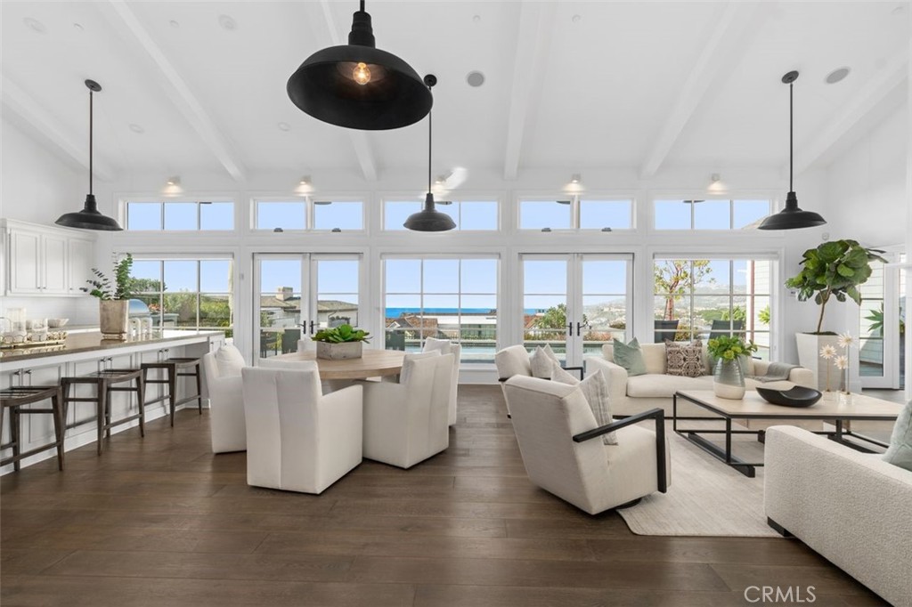 19 Seabreeze Terrace Dana Point, CA 92629 - Photo 11 of 40 a living room with lots of furniture and a chandelier