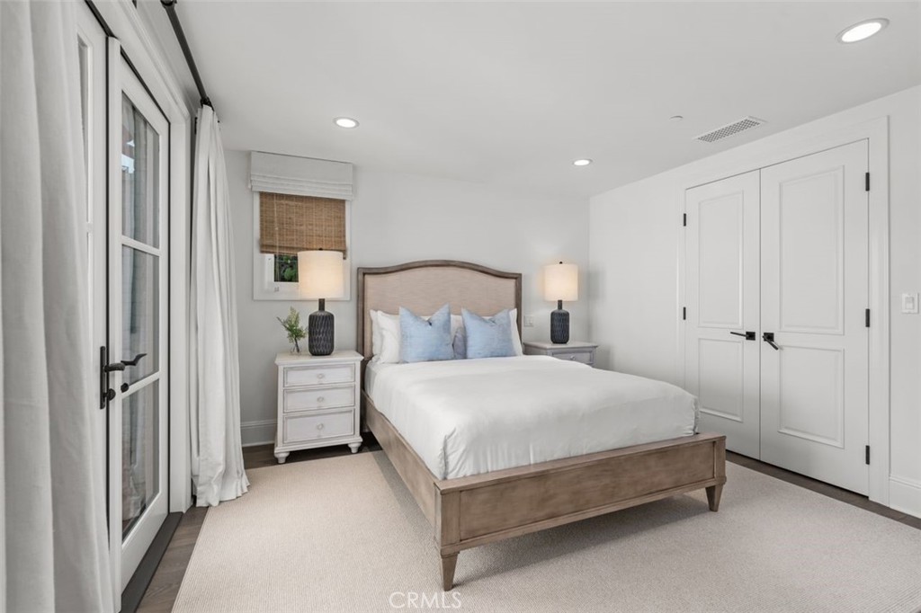 19 Seabreeze Terrace Dana Point, CA 92629 - Photo 26 of 40 a bed room with a bed and a refrigerator