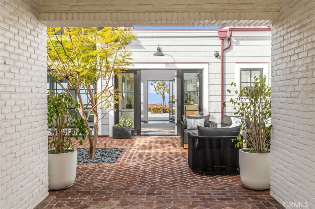 19 Seabreeze Terrace Dana Point, CA 92629 - Photo 4 of 40 a view of a patio with table and chairs and potted plants