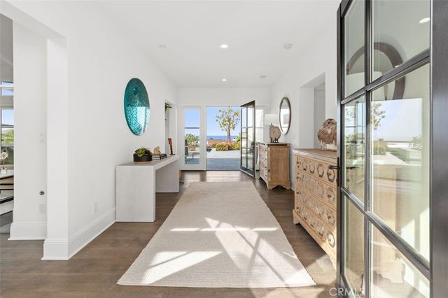 a living room with furniture fireplace and a chandelier