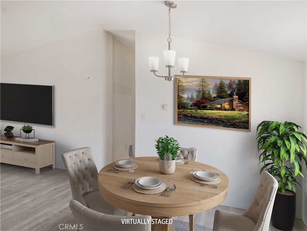 17647 Palowalla Road Blythe, CA 92225 - Photo 13 of 23 a dining room with furniture and wooden floor