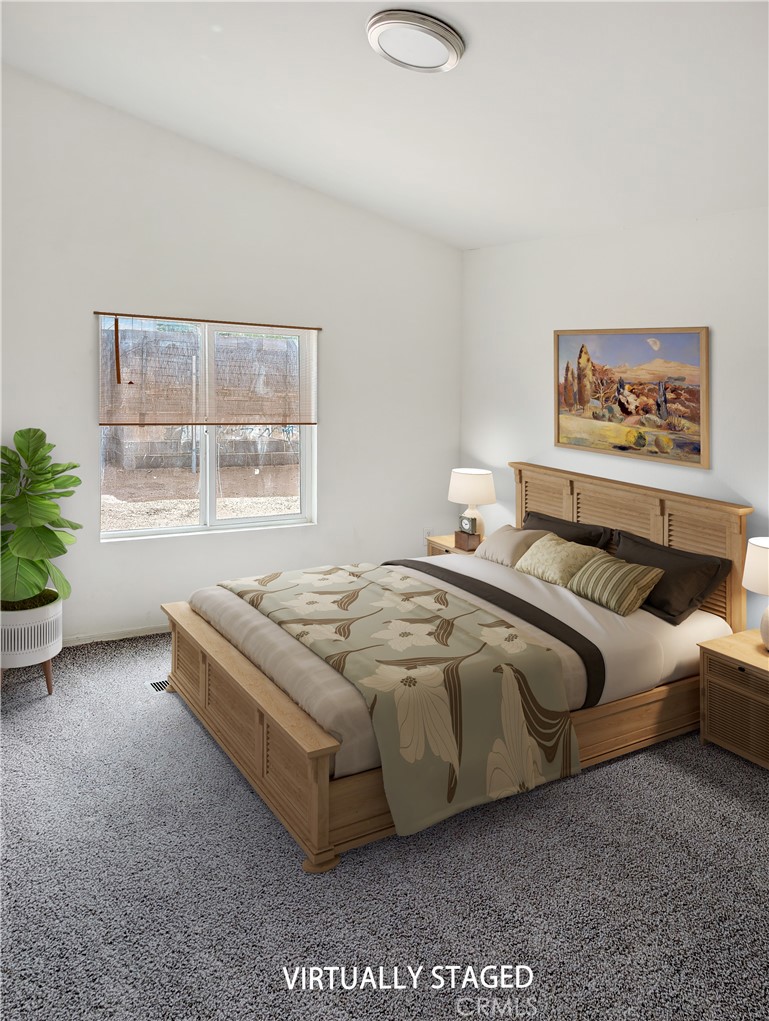 17647 Palowalla Road Blythe, CA 92225 - Photo 19 of 23 a spacious bedroom with a bed and a window