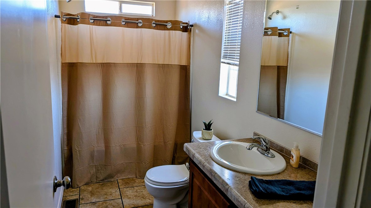 17647 Palowalla Road Blythe, CA 92225 - Photo 20 of 23 a bathroom with a sink and a mirror