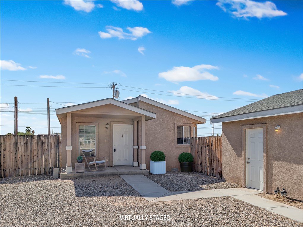 17647 Palowalla Road Blythe, CA 92225 - Photo 2 of 23 a view of a house with potted plants