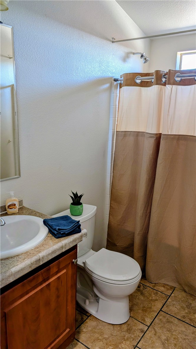17647 Palowalla Road Blythe, CA 92225 - Photo 21 of 23 a bathroom with a sink a toilet and a mirror