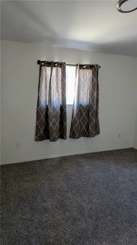a view of wooden floor and a cabinet
