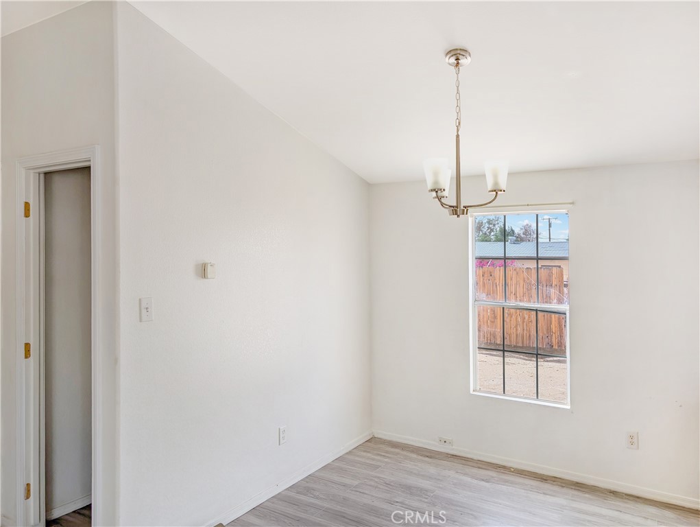 17647 Palowalla Road Blythe, CA 92225 - Photo 6 of 23 a view of an empty room with a window