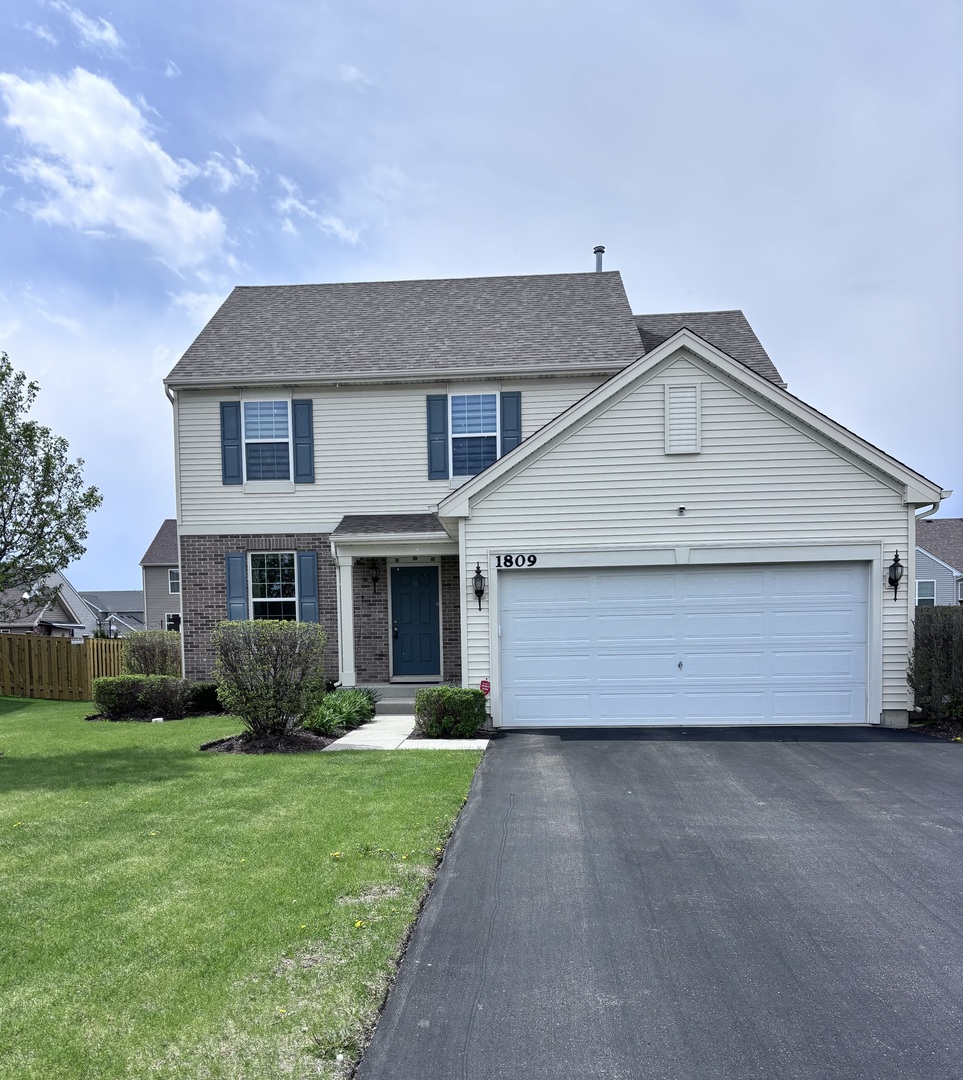 1809 Wesley Court Joliet, IL 60431 - Photo 2 of 29 a front view of house with yard and green space