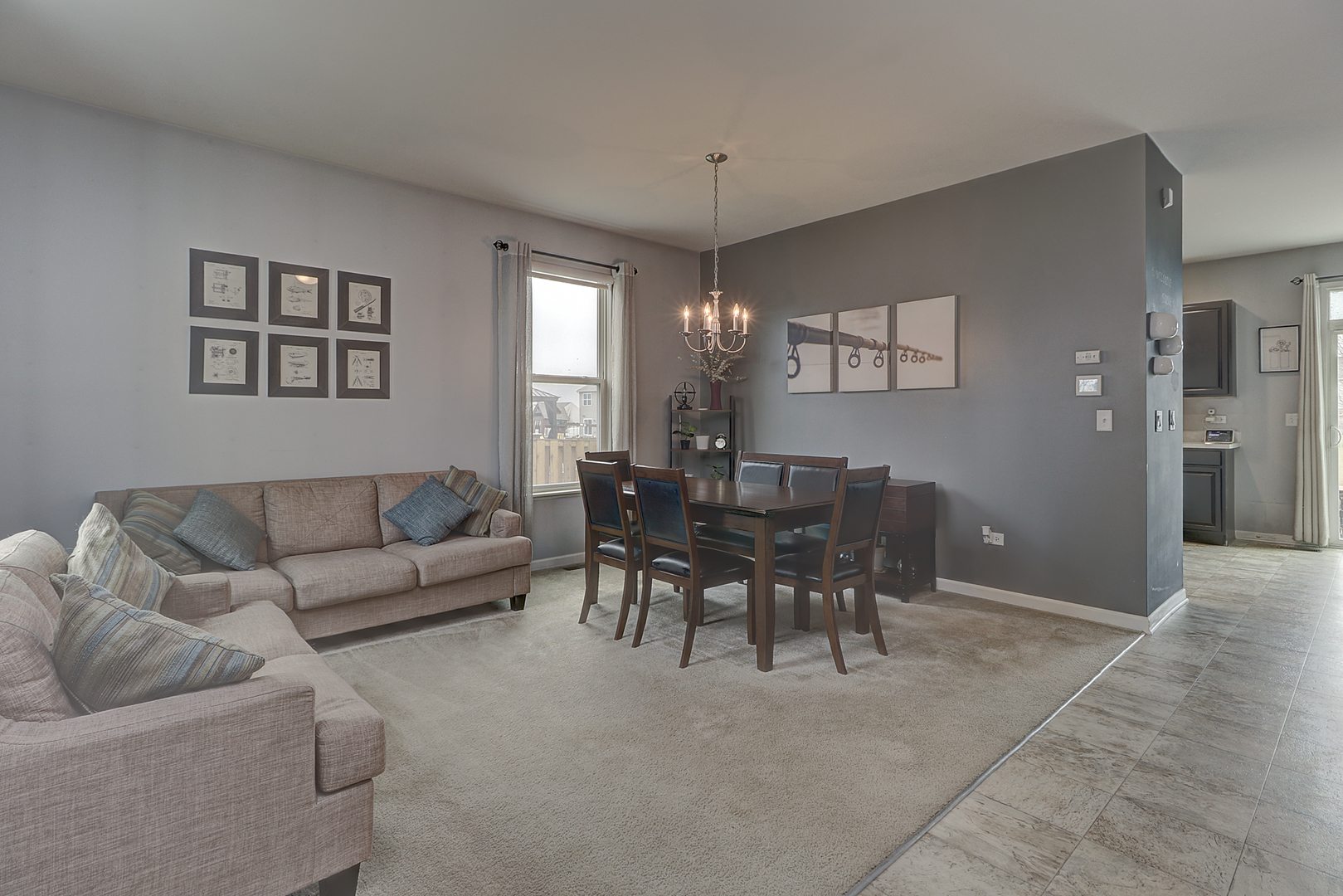 1809 Wesley Court Joliet, IL 60431 - Photo 3 of 29 a living room with furniture and a chandelier