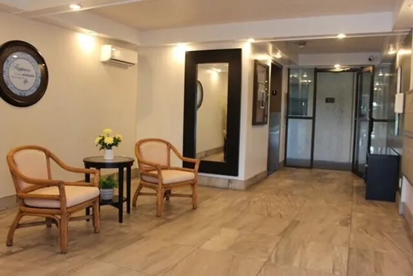 a kitchen with granite countertop a stove a sink and a microwave