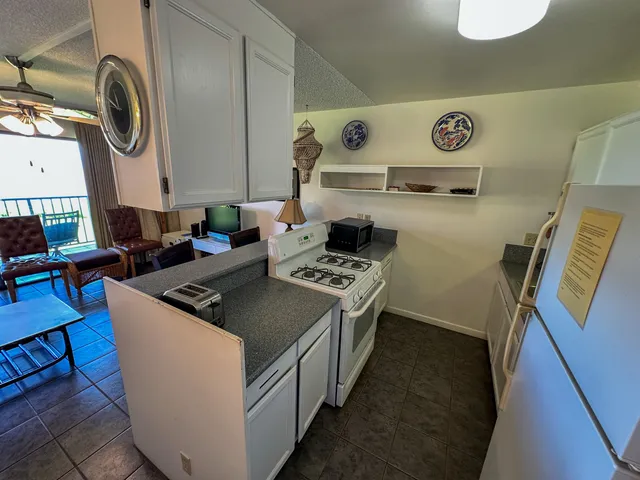 a kitchen with a stove and a sink