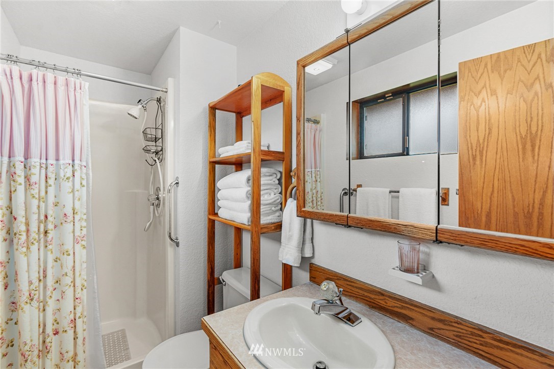 25431 Cromwell Road Monroe, WA 98272 - Photo 14 of 40 a bathroom with a sink and a mirror