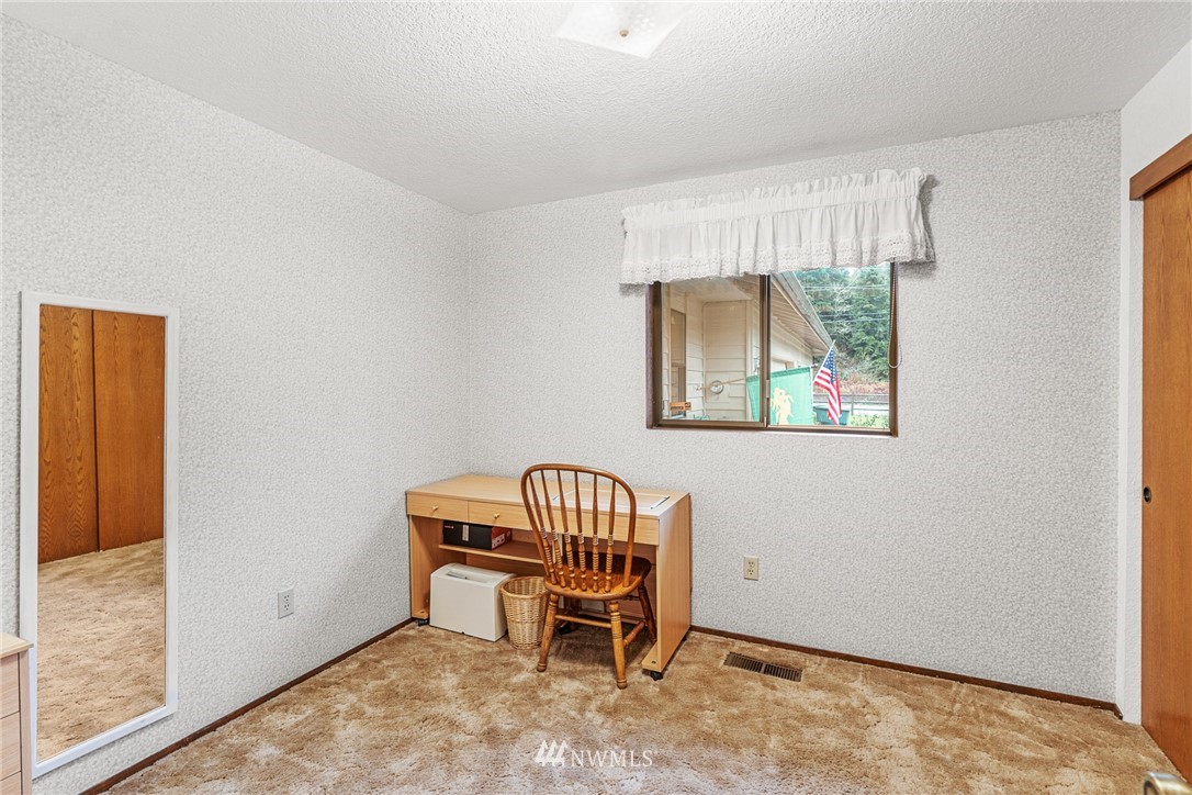 25431 Cromwell Road Monroe, WA 98272 - Photo 16 of 40 a room with a window and a dresser
